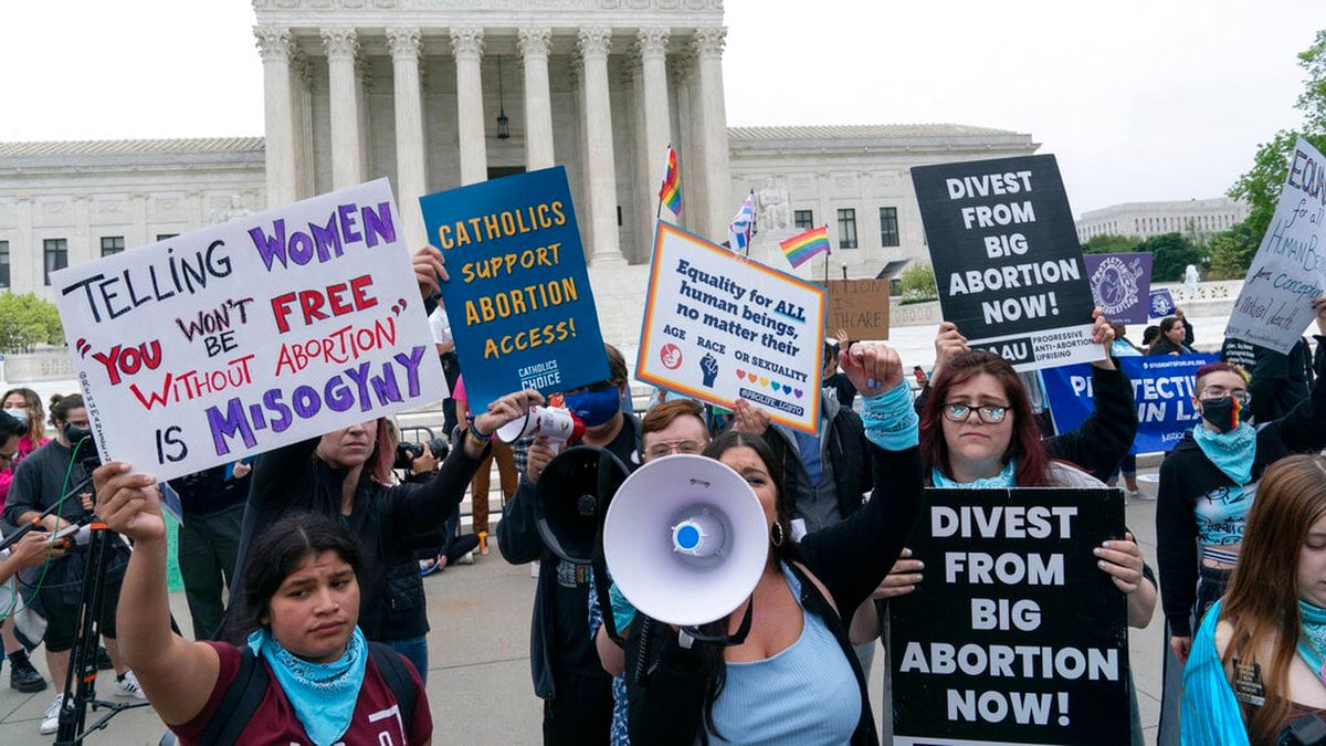 Demonstrators protest outside of the U.S. Supreme Court Tuesday, May 3, 2022 in Washington. A...