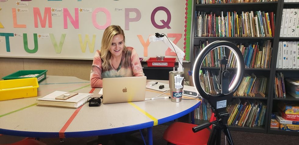 Miss Amy Aschenbeck works with one of her students during a live 1:1 learning session to focus...