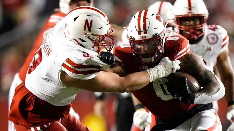 Nebraska's Ty Robinson (9) tackles Wisconsin's Braelon Allen (0) during the second half of an...