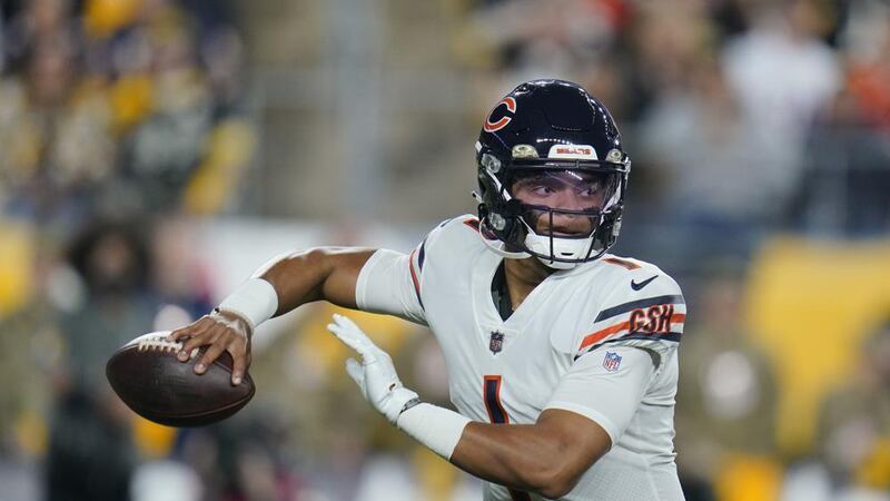 Chicago Bears quarterback Justin Fields (1) looks to pass against the Pittsburgh Steelers...