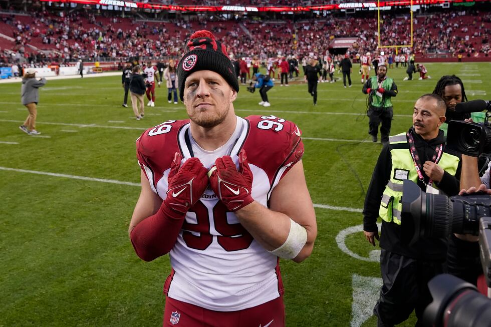 Arizona Cardinals defensive end J.J. Watt walks off the field after an NFL football game...