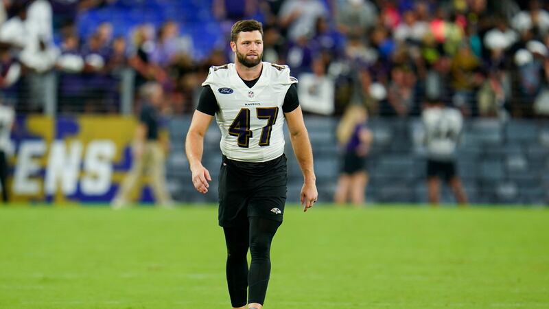 Baltimore Ravens linebacker Vince Biegel walks on the field after the team's NFL football...