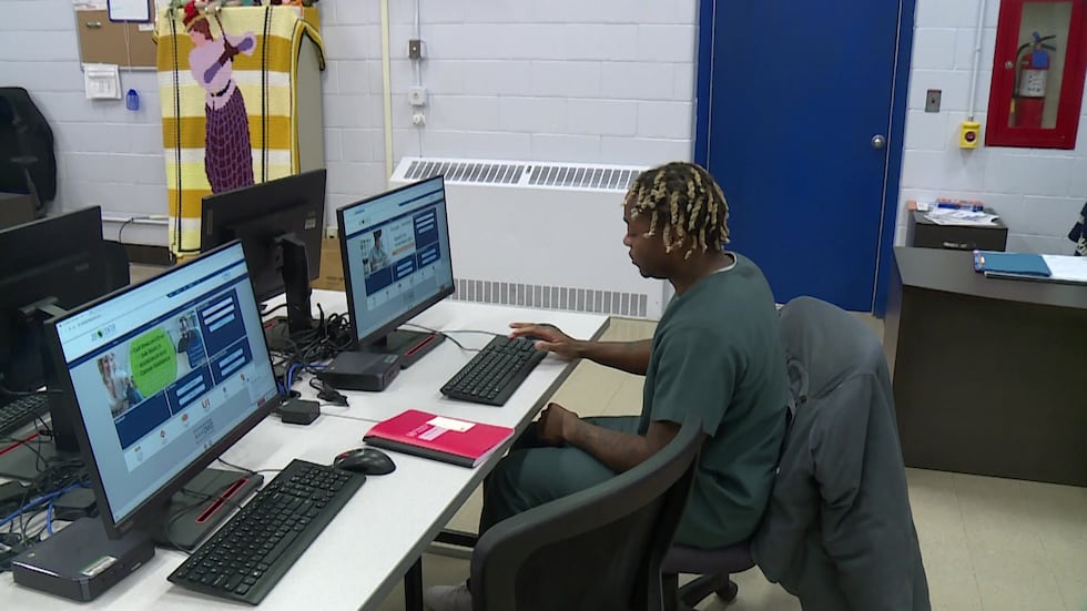 Kettle Moraine Correctional Job Center client Ray Jones uses a computer inside the job center.