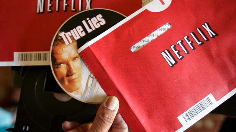 File - Mei Michelson prepares to watch a Netflix DVD at her home in Palo Alto, Calif., on Oct....