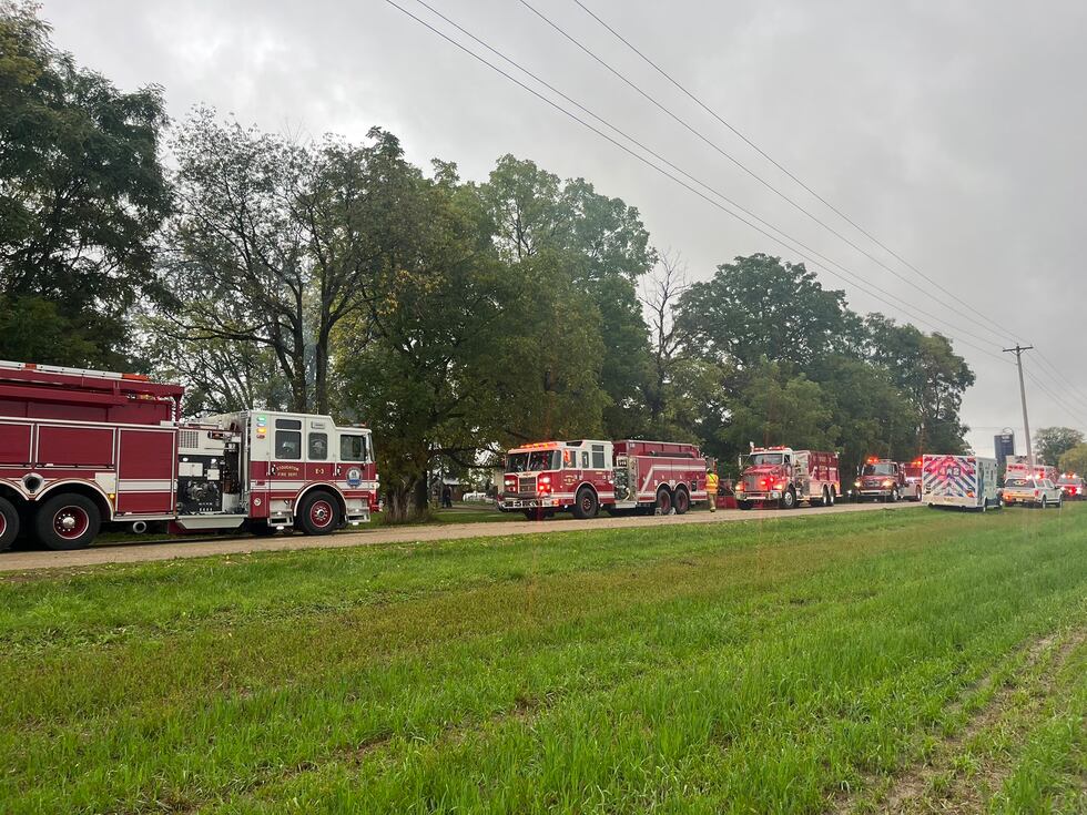Fire trucks lined up along a rural road