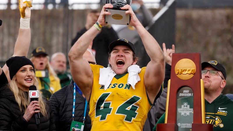 North Dakota State fullback Hunter Luepke (44) celebrates with his most valuable player award...