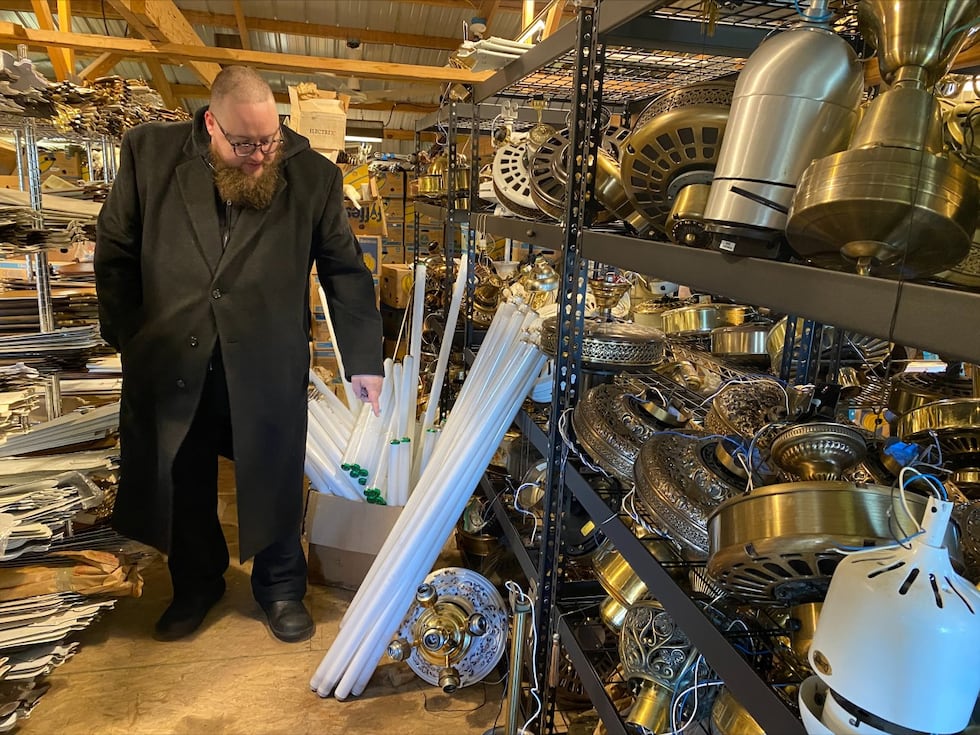 Dan “Spiffy” Neuman showcases part of his ceiling fan collection in a barn that he rents near...
