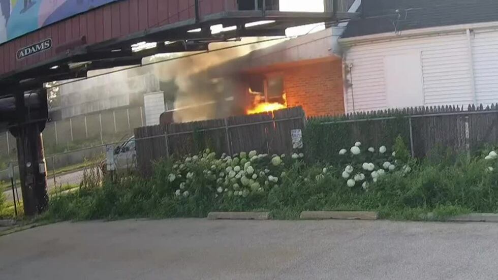 Surveillance camera footage shows the fire at a Madison tattoo parlor that investigators...