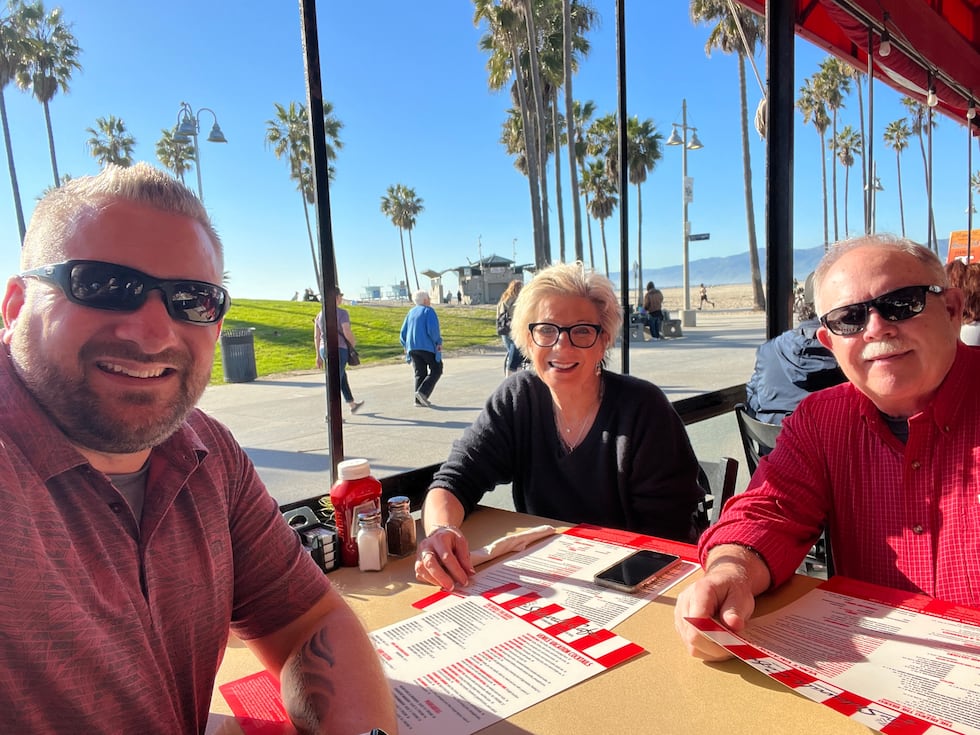 Andrew Drake with his parents, Anne & Tim Olson, in California.