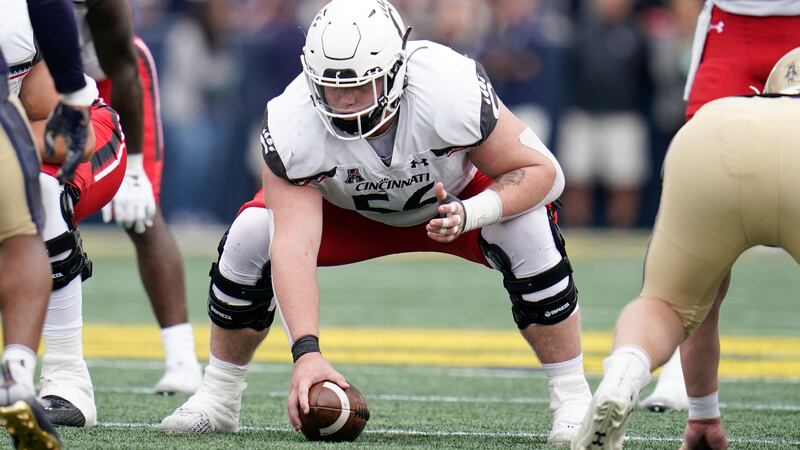 Cincinnati center Jake Renfro prepares to snap the ball against Navy during the second half of...