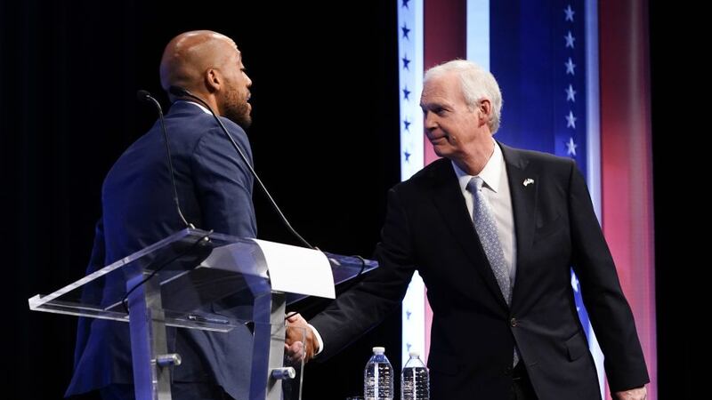 Republican U.S. Senate candidate Ron Johnson, right, and Democratic U.S. Senate candidate...