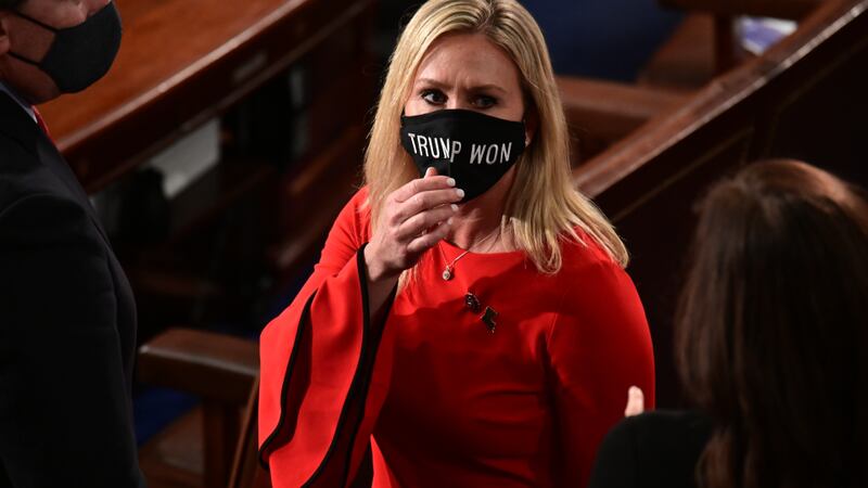 FILE - In this Sunday, Jan. 3, 2021, file photo, Rep. Marjorie Taylor Greene, R-Ga., wears a...