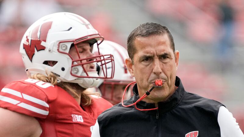 Wisconsin head coach Luke Fickell watches warm ups before an NCAA college football game...