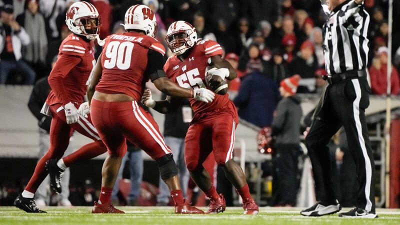 Wisconsin's Maema Njongmeta (55) reacts after recovering a fumble during the first half of an...