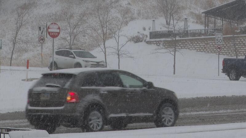 Snowy conditions make it difficult for drivers to see the road in front of them.