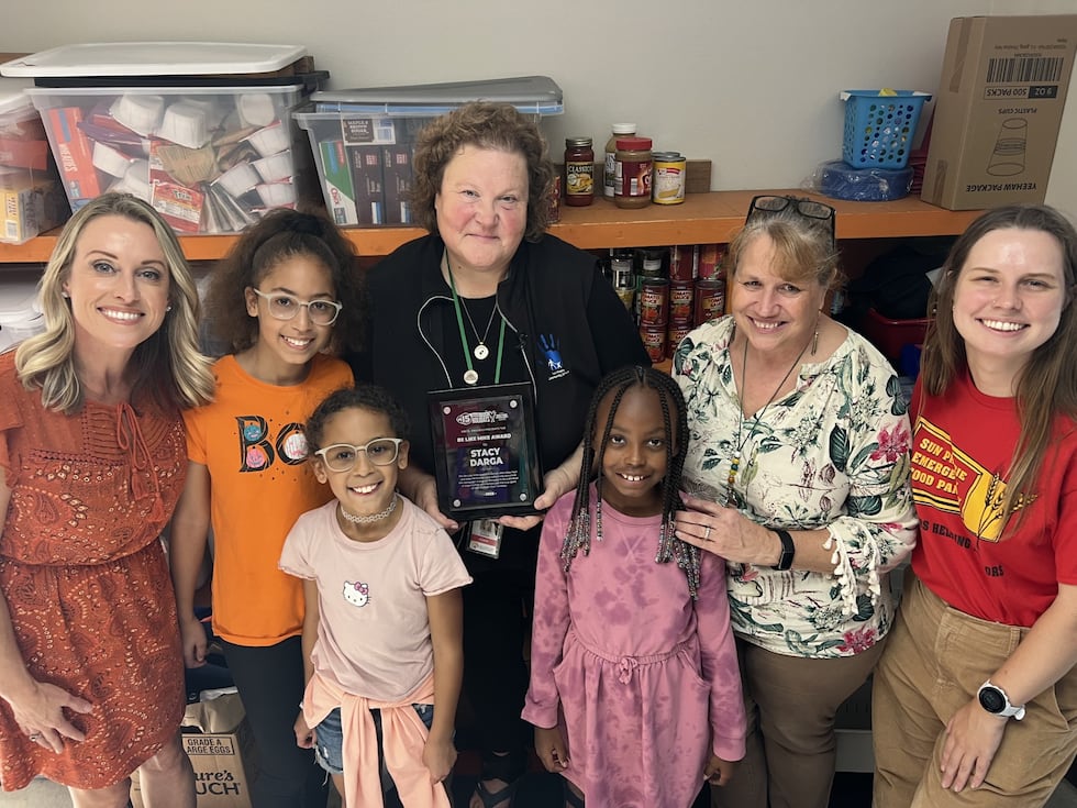 Stacy Darga is awarded the "Be Like Mike" award for her work with students and families in the...