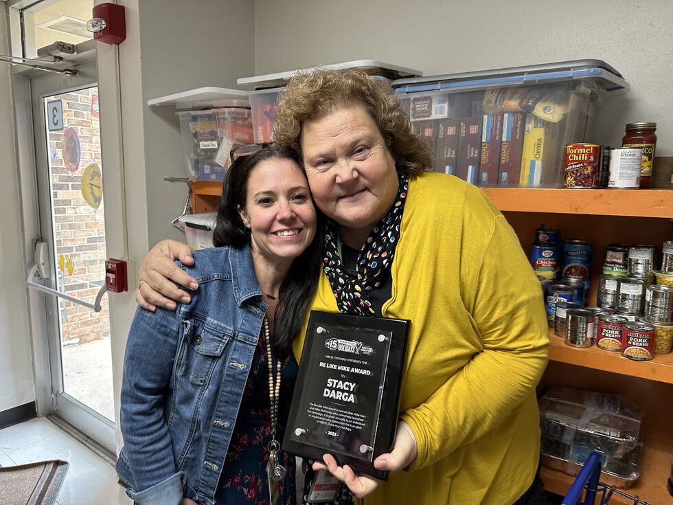 Stacy Darga and Westside Principal Nikki Harcus celebrate her "Be Like Mike" award.