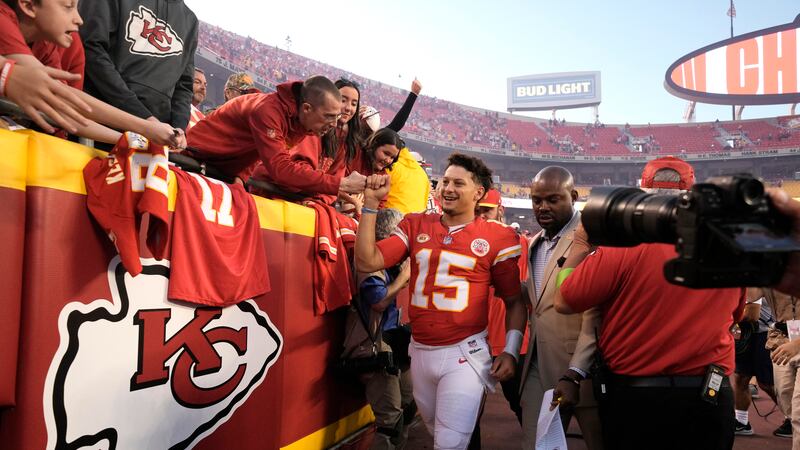 Kansas City Chiefs quarterback Patrick Mahomes heads off the field following an NFL football...